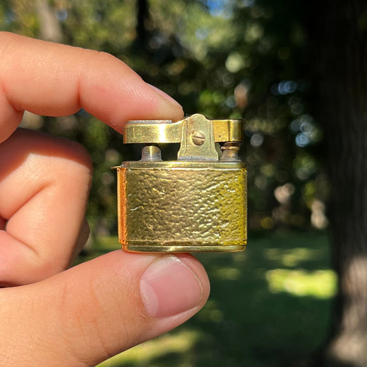 1950s Gold tone Penguin lighter.
