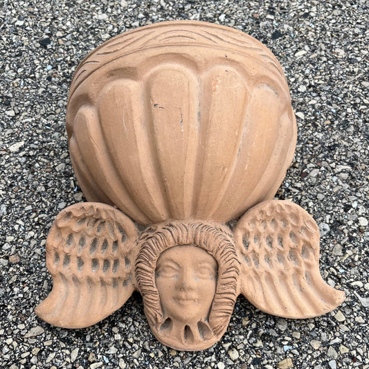 Vintage clay cherub wall planter.