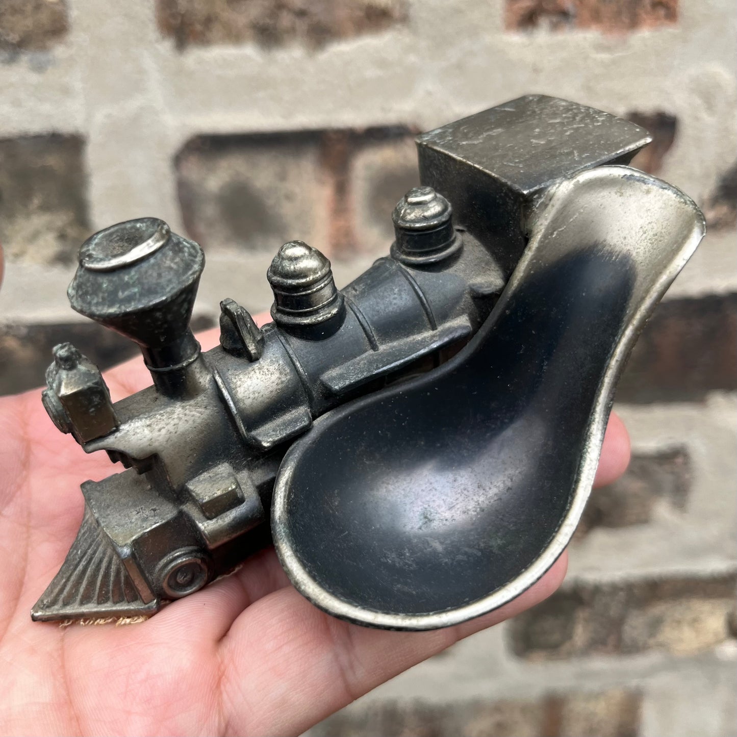 Vintage pewter train pipe holder.