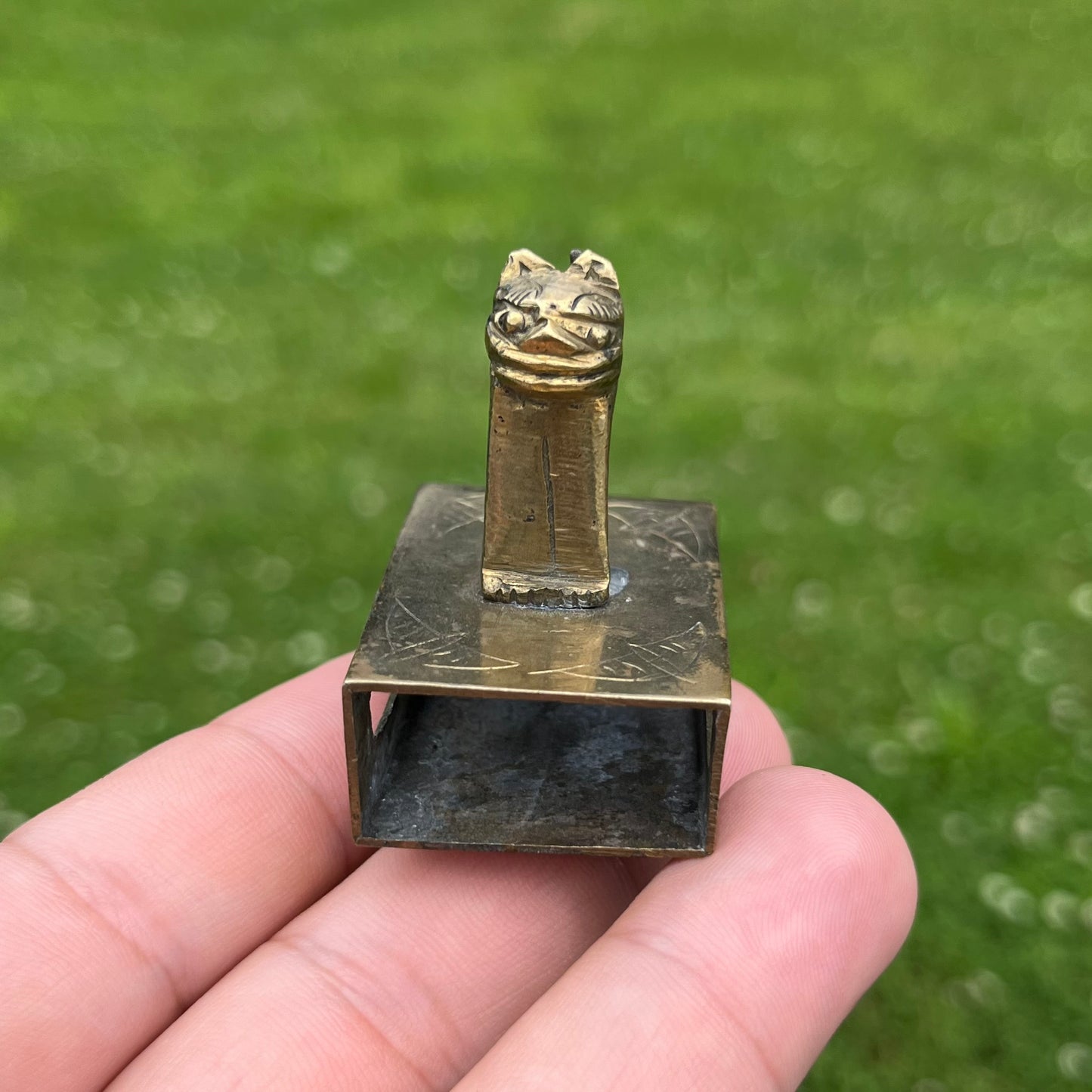 Vintage brass cat matchbook safe.