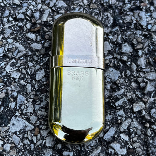 Vintage brass Marlboro pocket lighter.