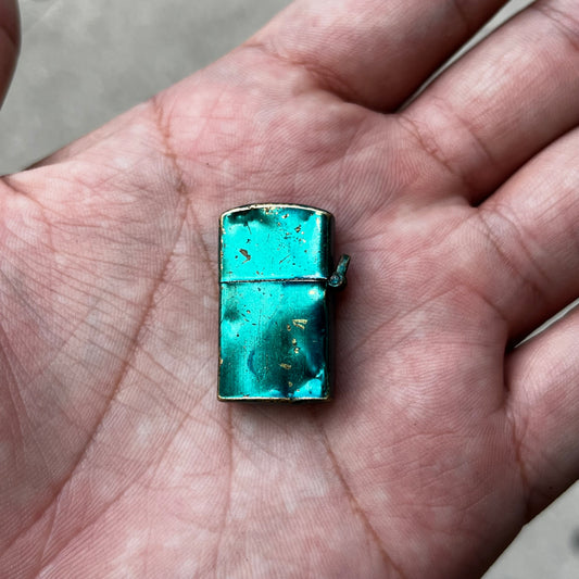 Mini 1960s flip lighter.