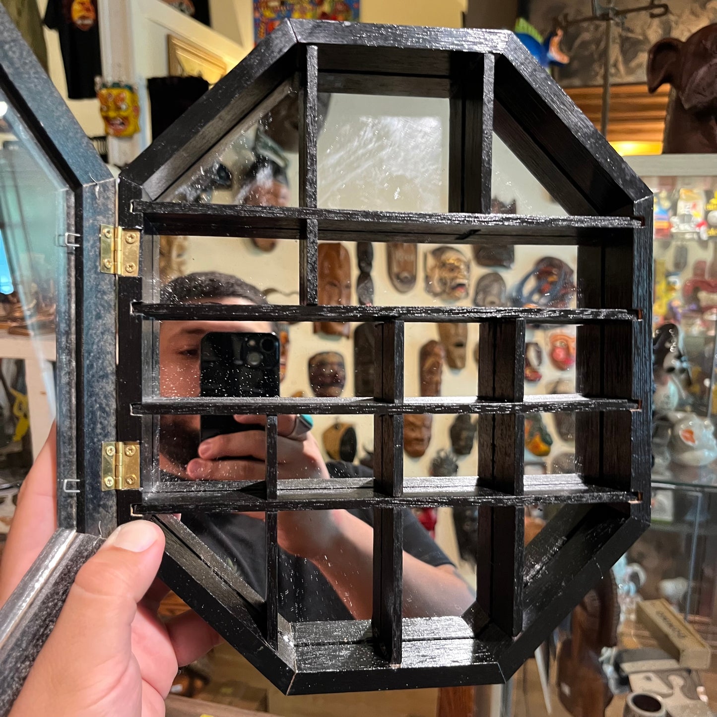 Vintage wall hanging octagon shaped curio cabinet.