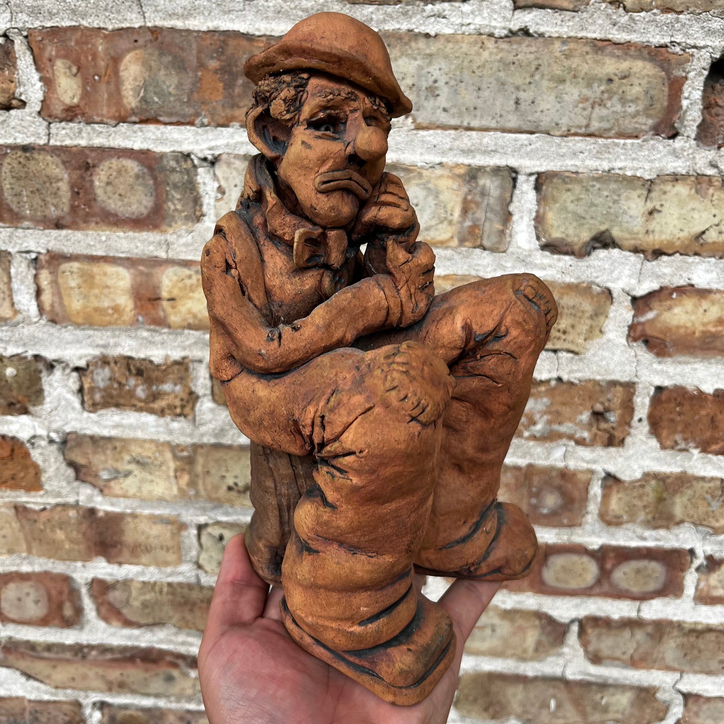 1987 Clay clown sculpture.