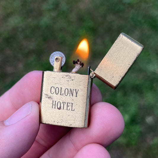 Vintage Brass Colony Hotel flip lighter.