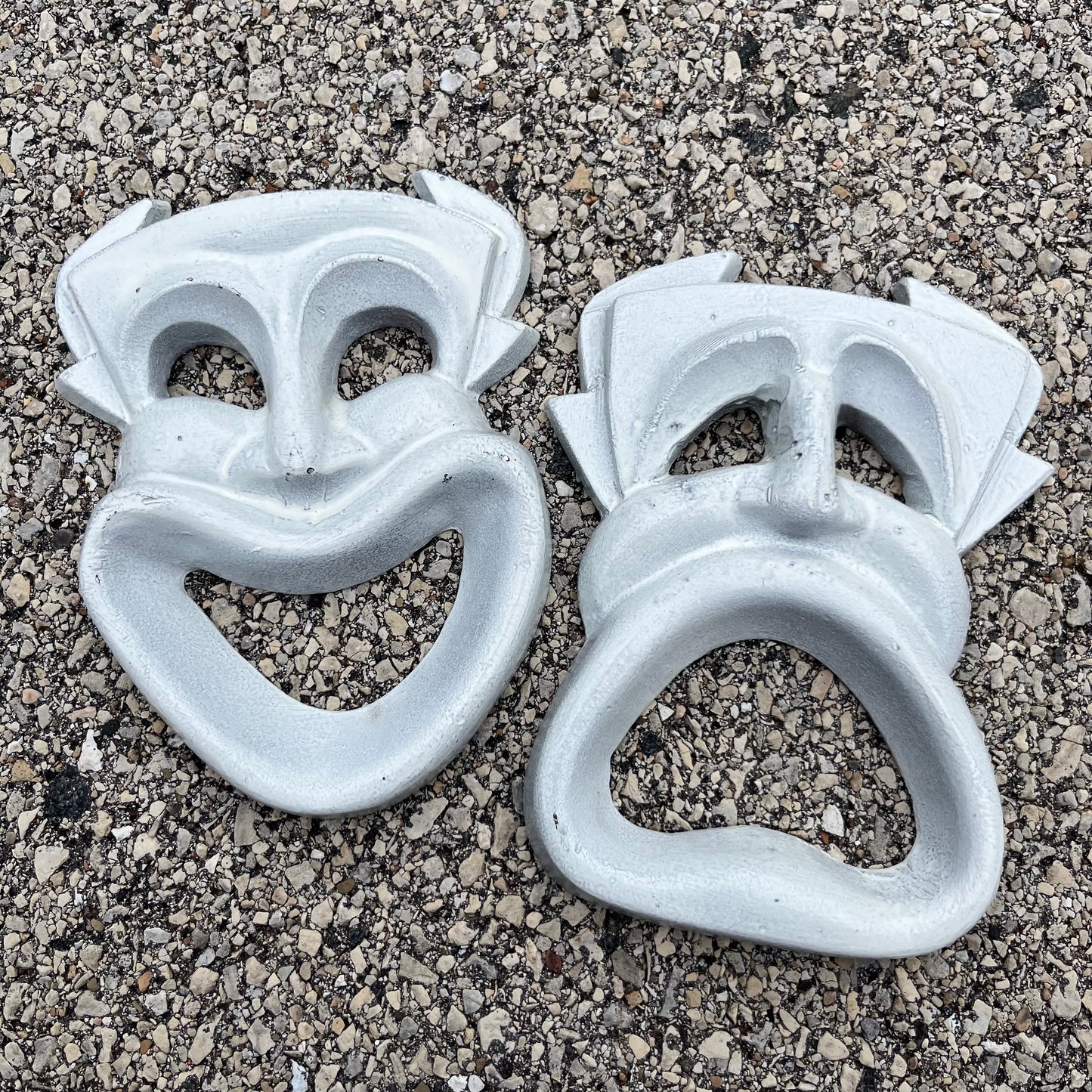 Vintage cast iron drama masks.