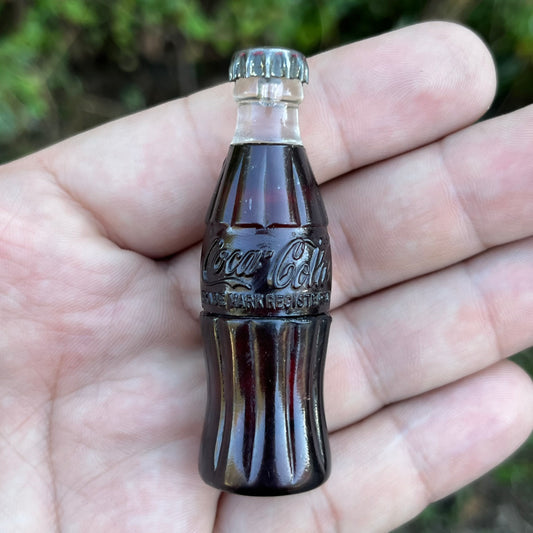 Vintage Coca-Cola bottle lighter.