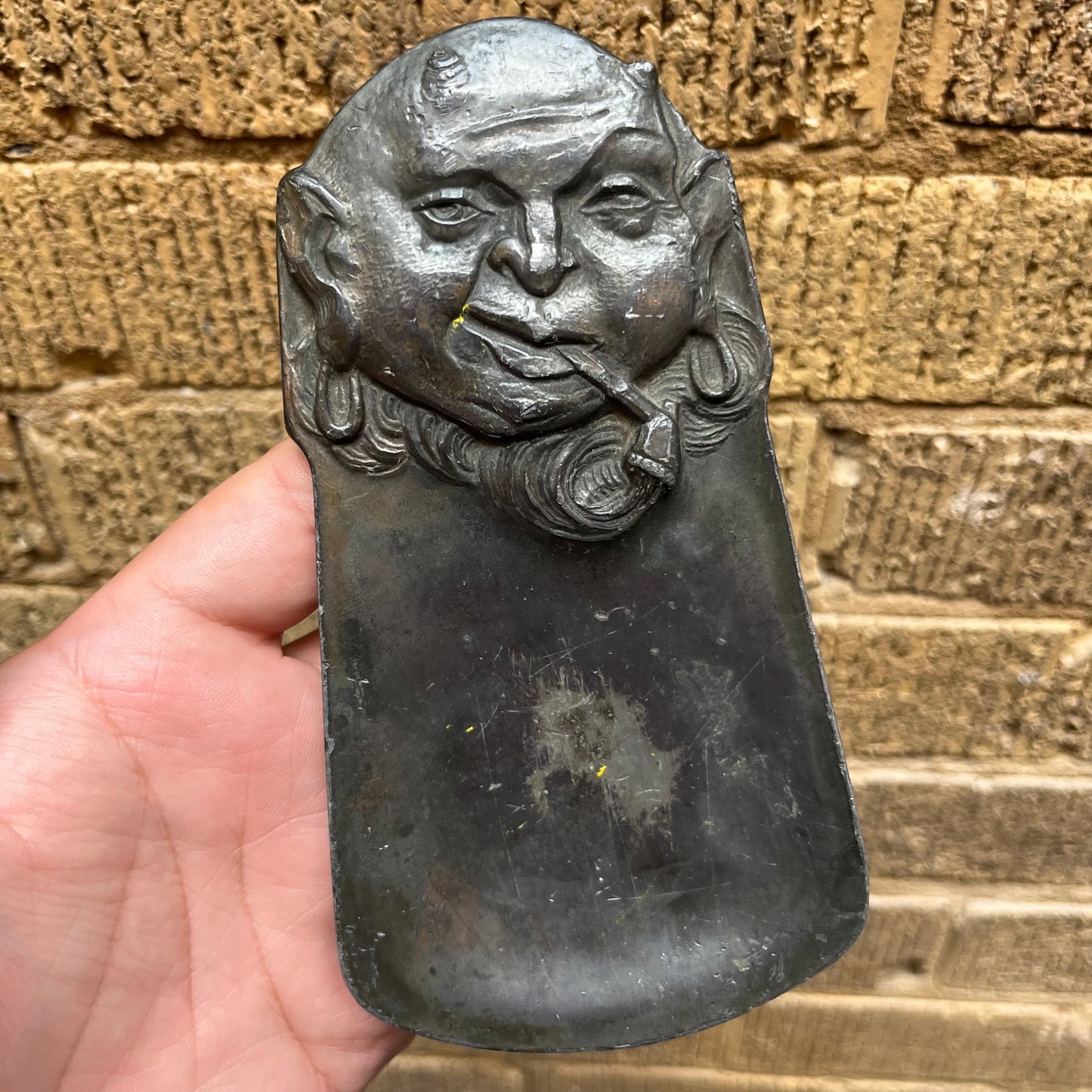 Vintage pewter pipe smoking devil dish.