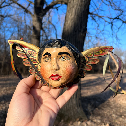 Vintage decorative cherub wood carving.