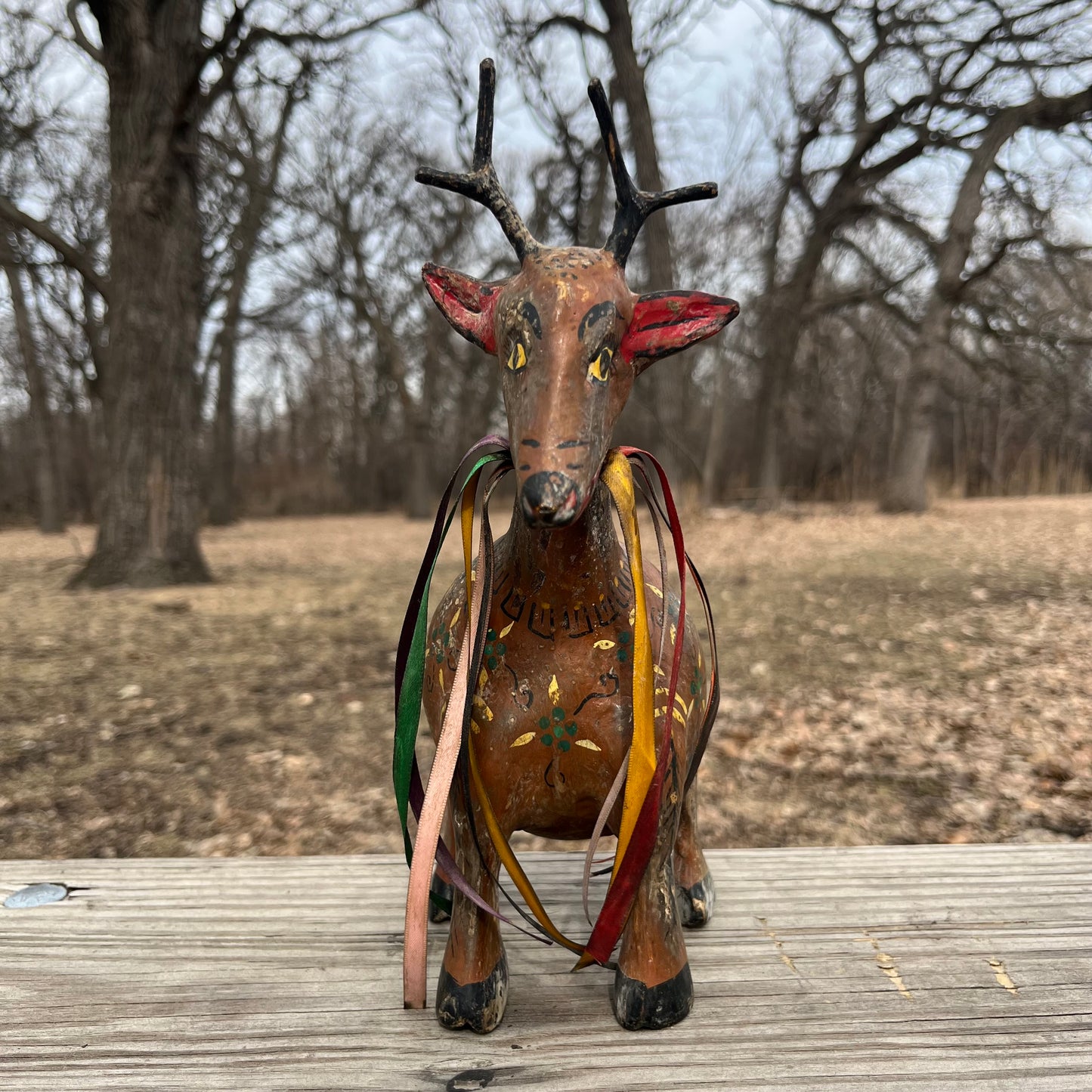 Hand crafted deer gourd maraca.
