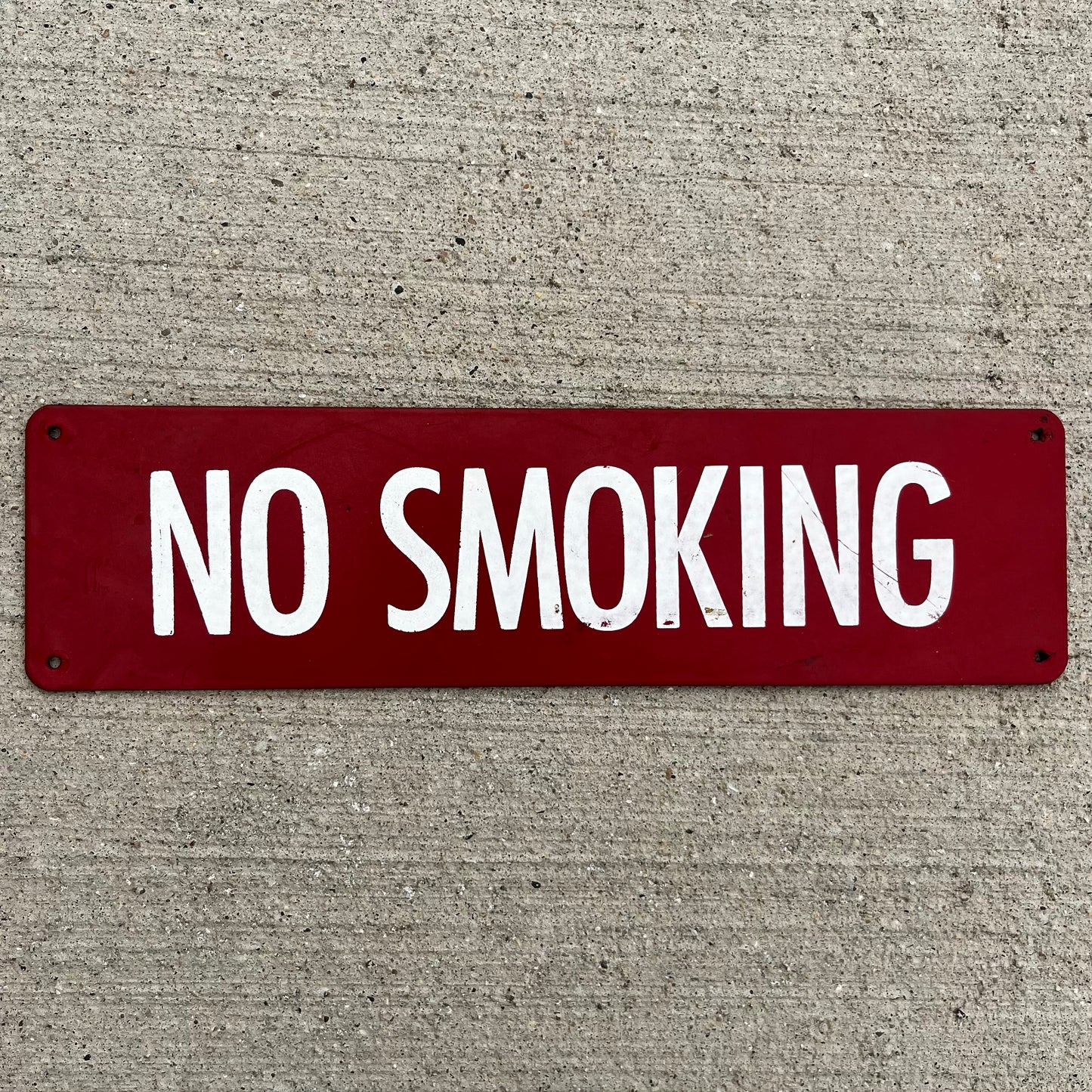 Vintage “No Smoking” metal sign.