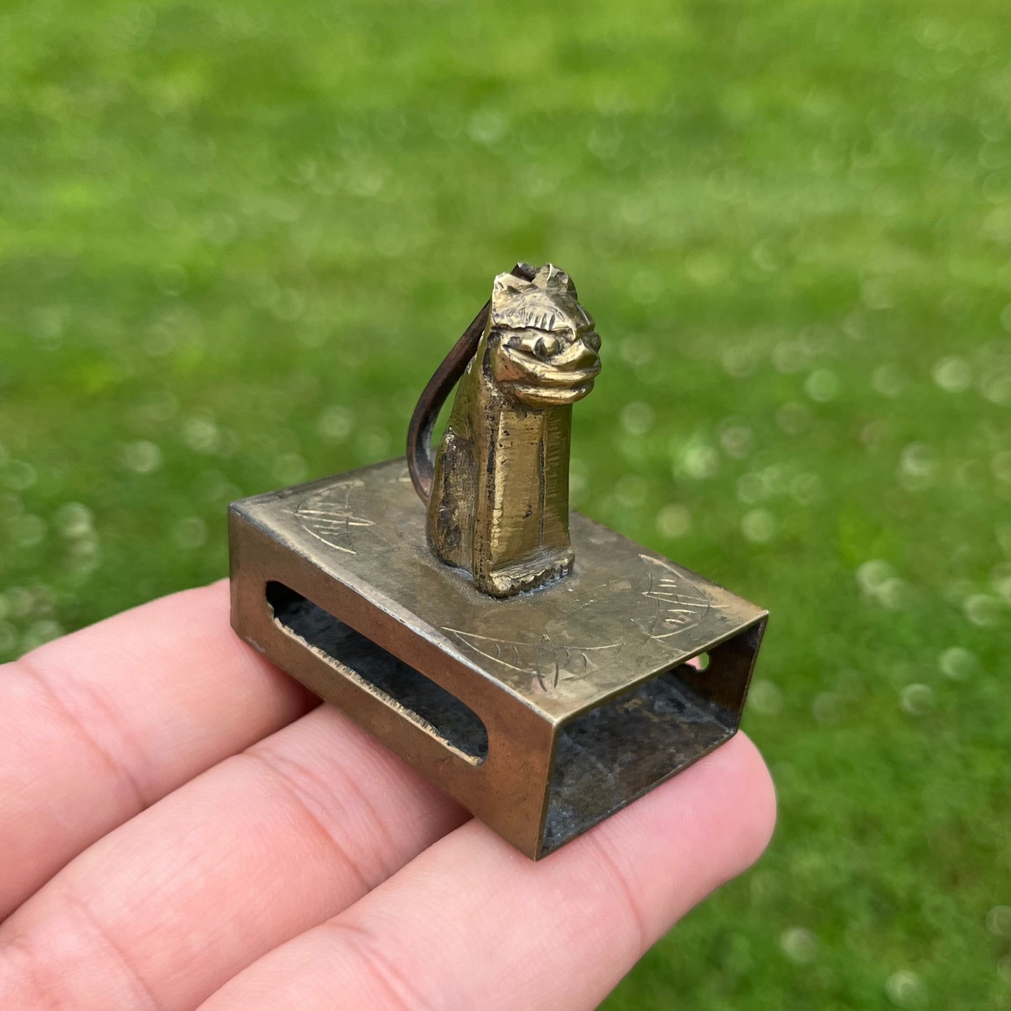 Vintage brass cat matchbook safe.