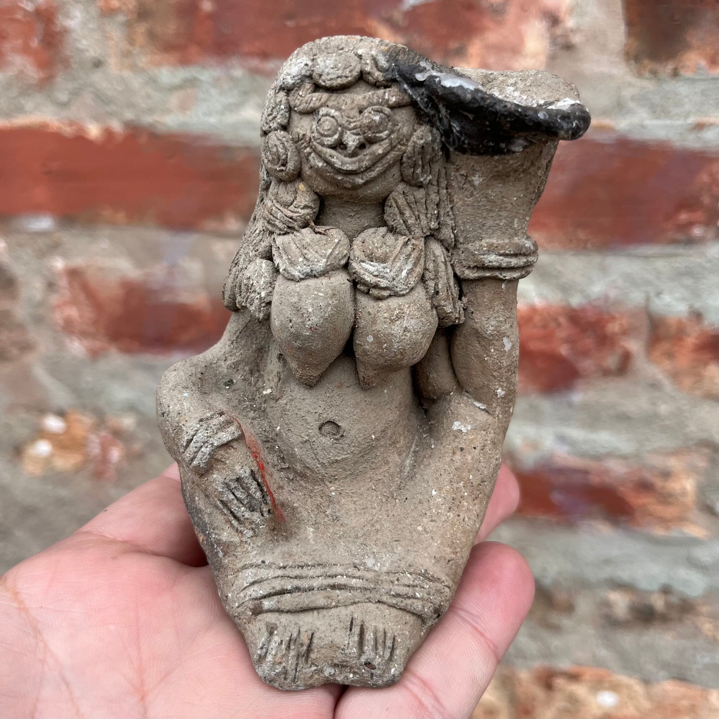 Clay Balinese candle holder figurine.