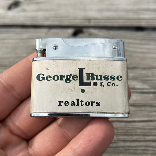 Vintage George L. Busse co. flat lighter.