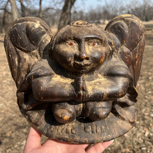 1980s Hand crafted cherub with glass eyes.