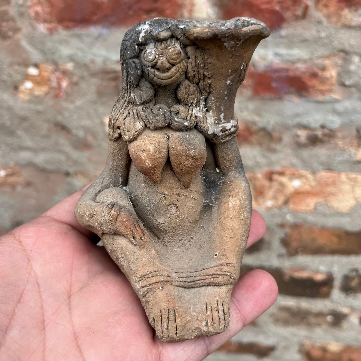 Clay Balinese candle holder figurine.