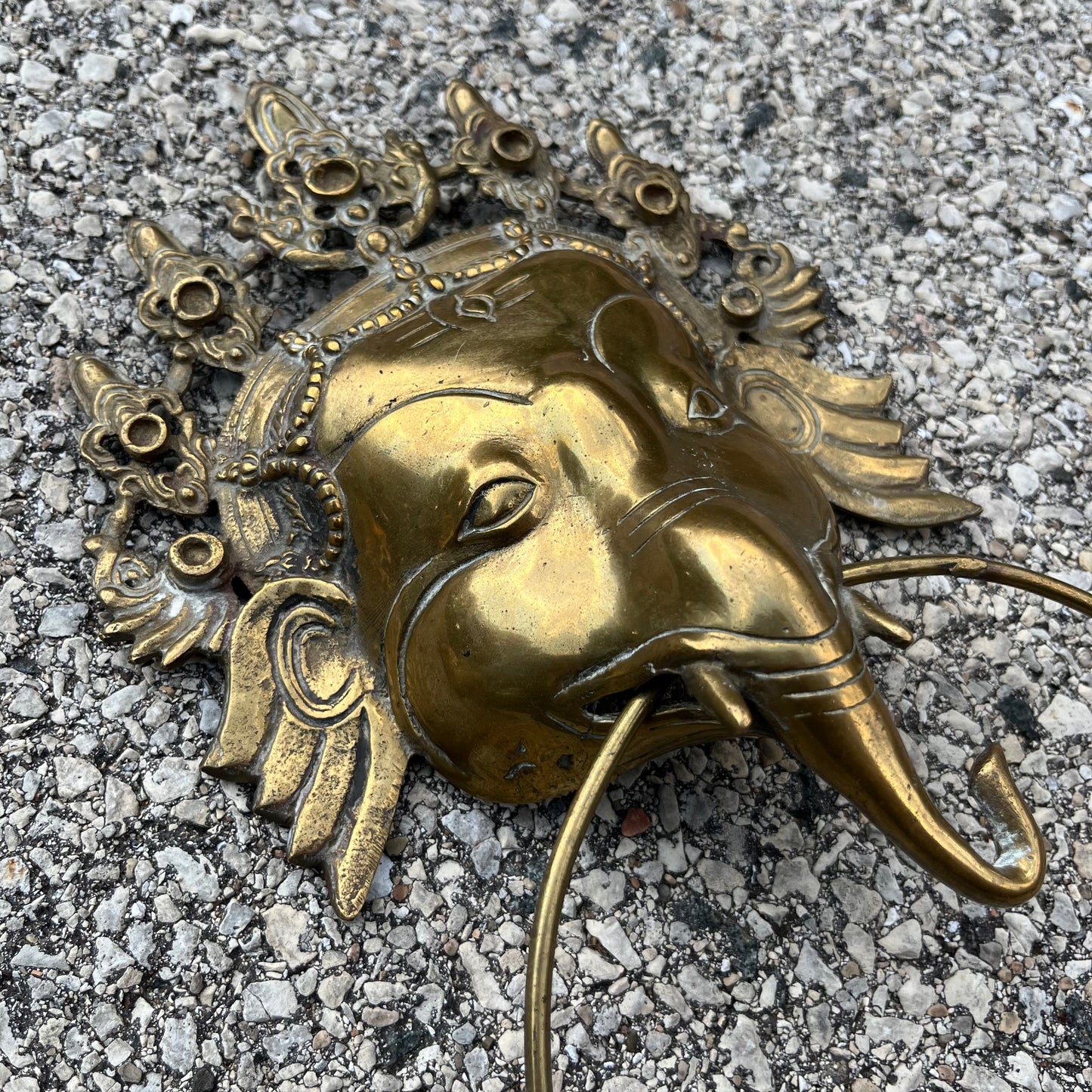 Vintage brass Ganesh cloth holder.