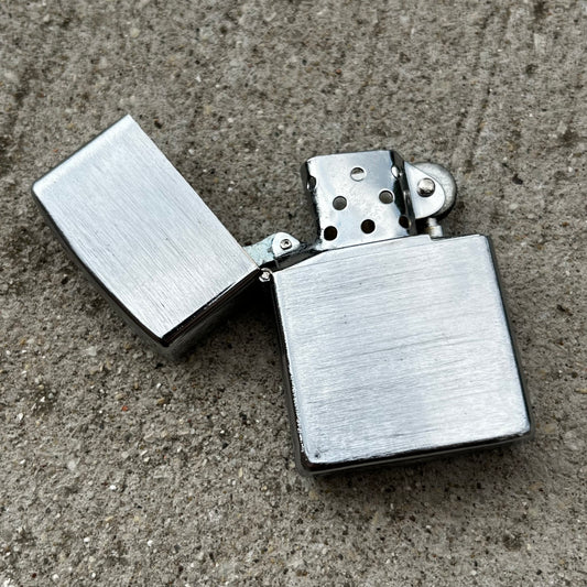 Vintage S.M.C. flip lighter.