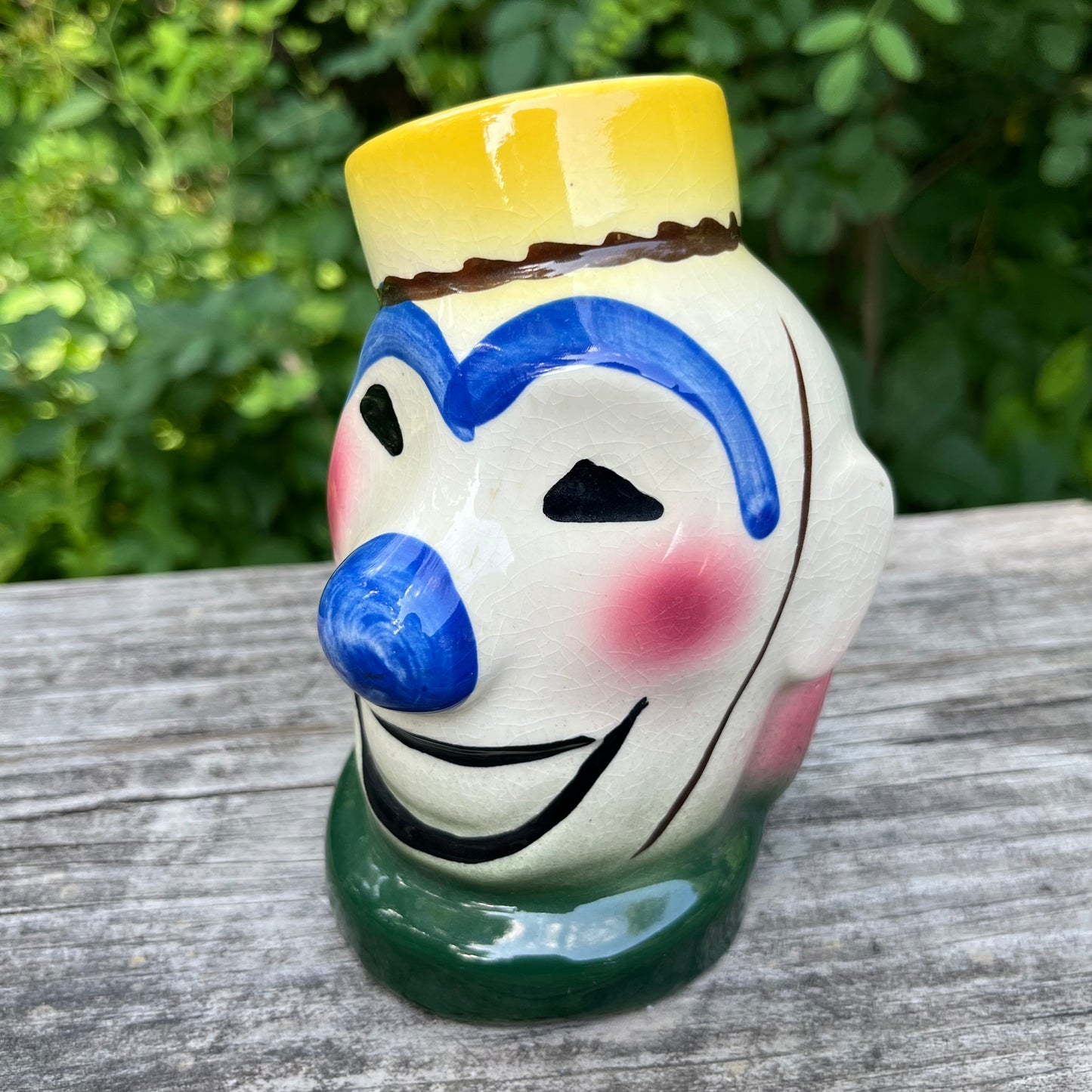 Vintage ceramic bellhop clown coin bank.