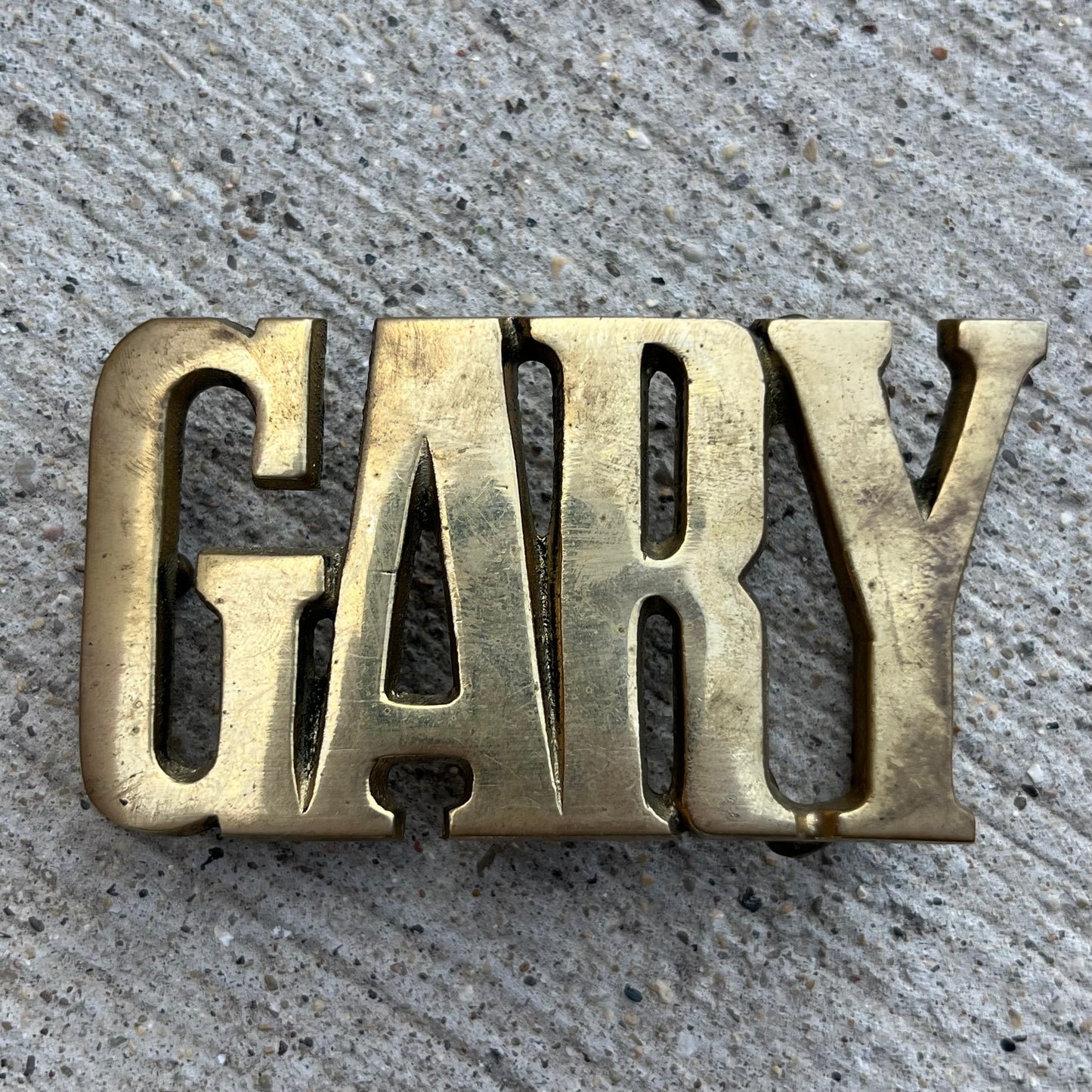1978 Brass “Gary” belt buckle.