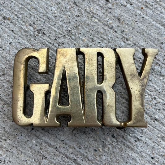 1978 Brass “Gary” belt buckle.