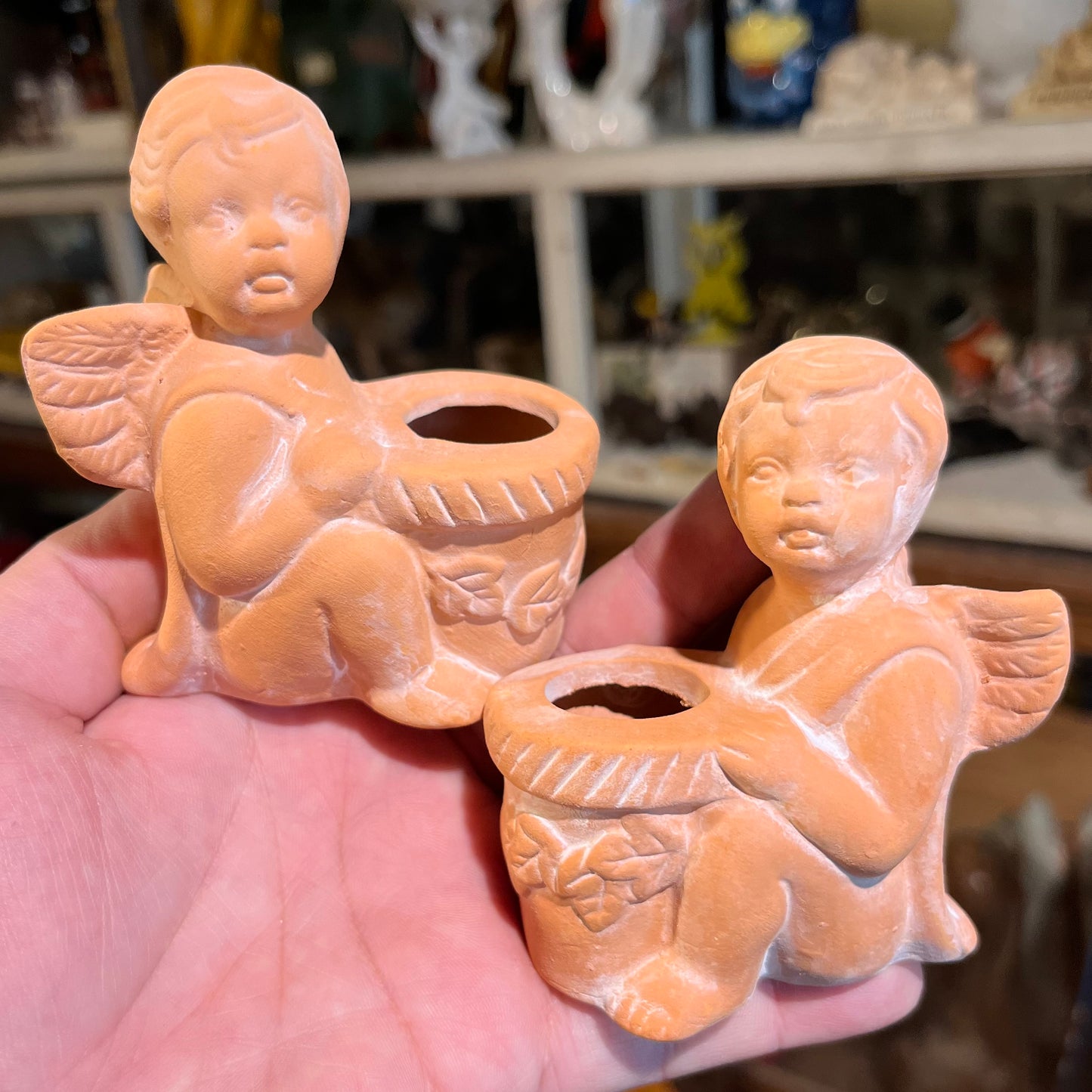 1998 Clay Cherub candle holder set.