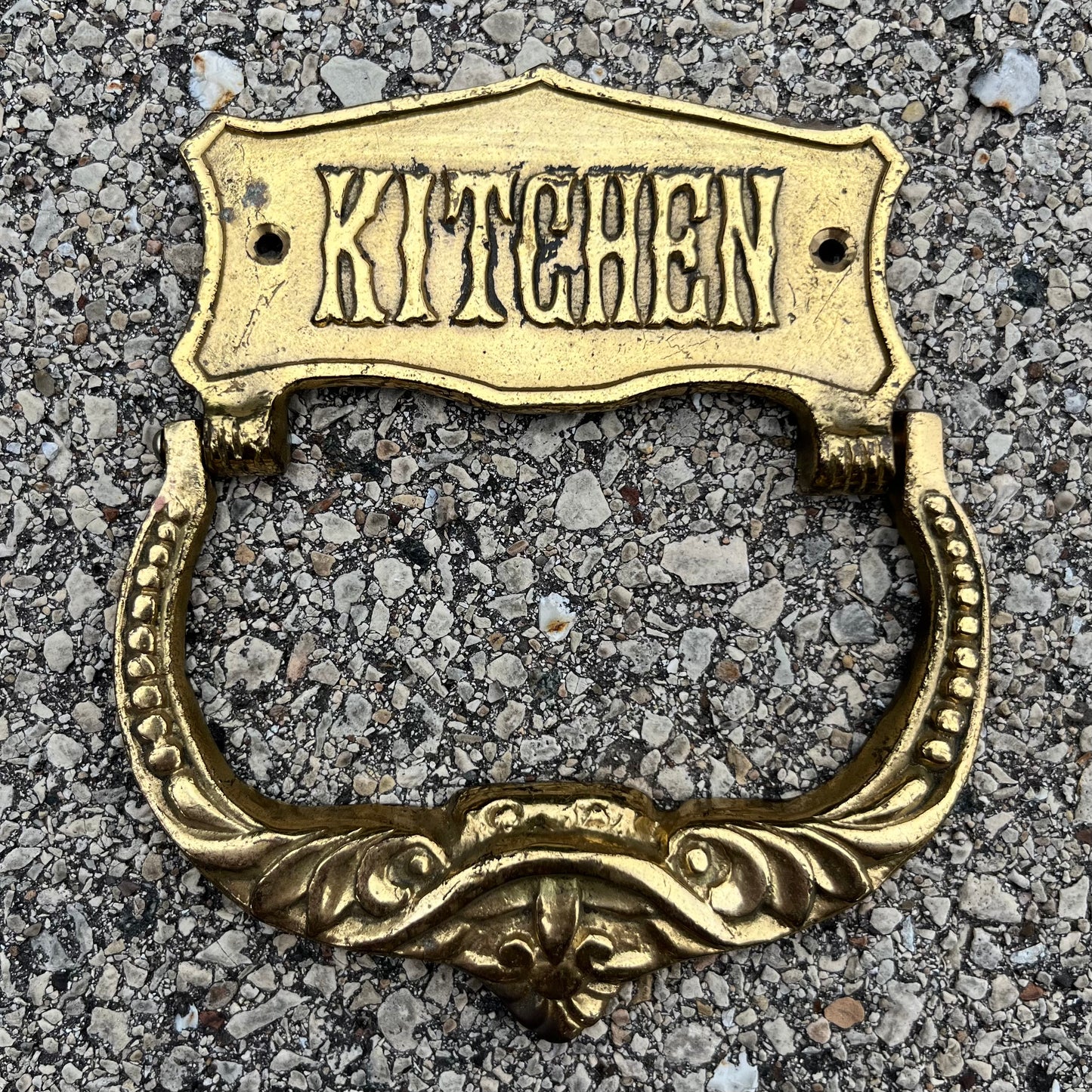 Vintage brass kitchen door knocker.