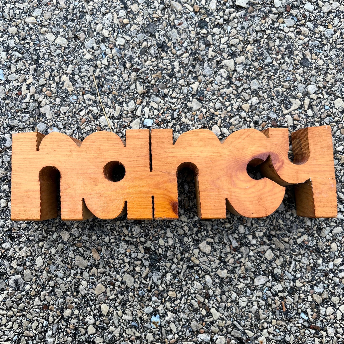 90s “Nancy” wood carving.