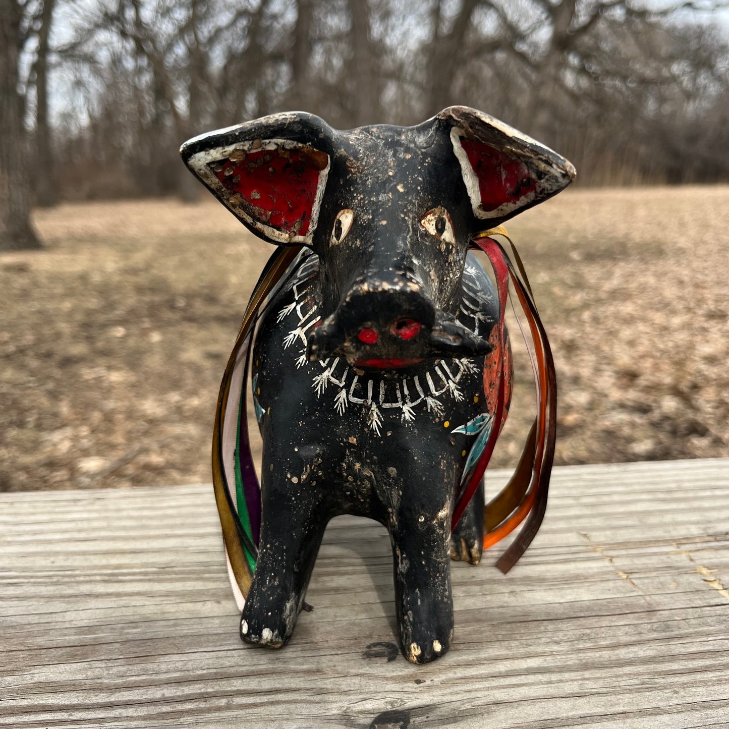 Hand crafted boar gourd maraca.