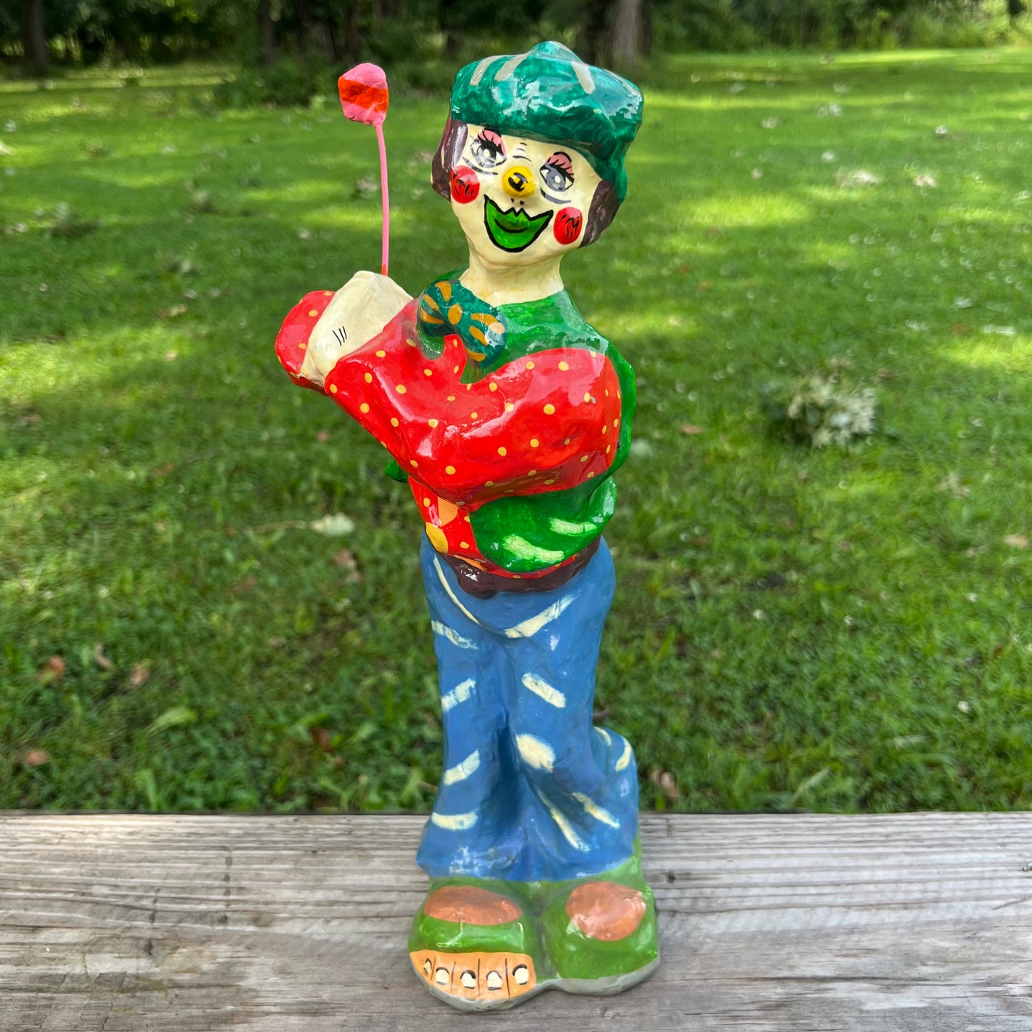Vintage paper mache golfer clown.