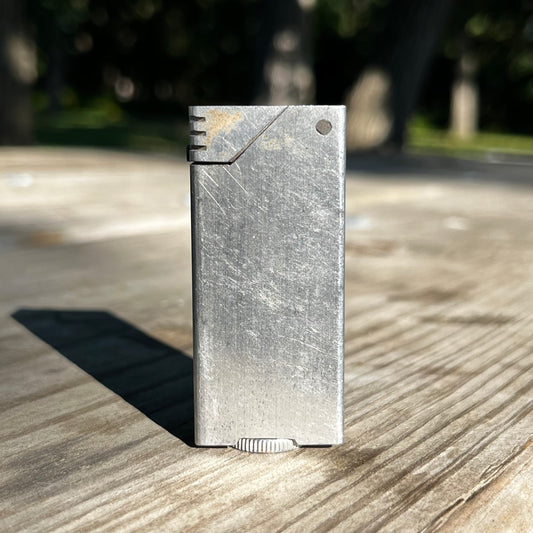 1940s Alluminum brick trench art lighter.