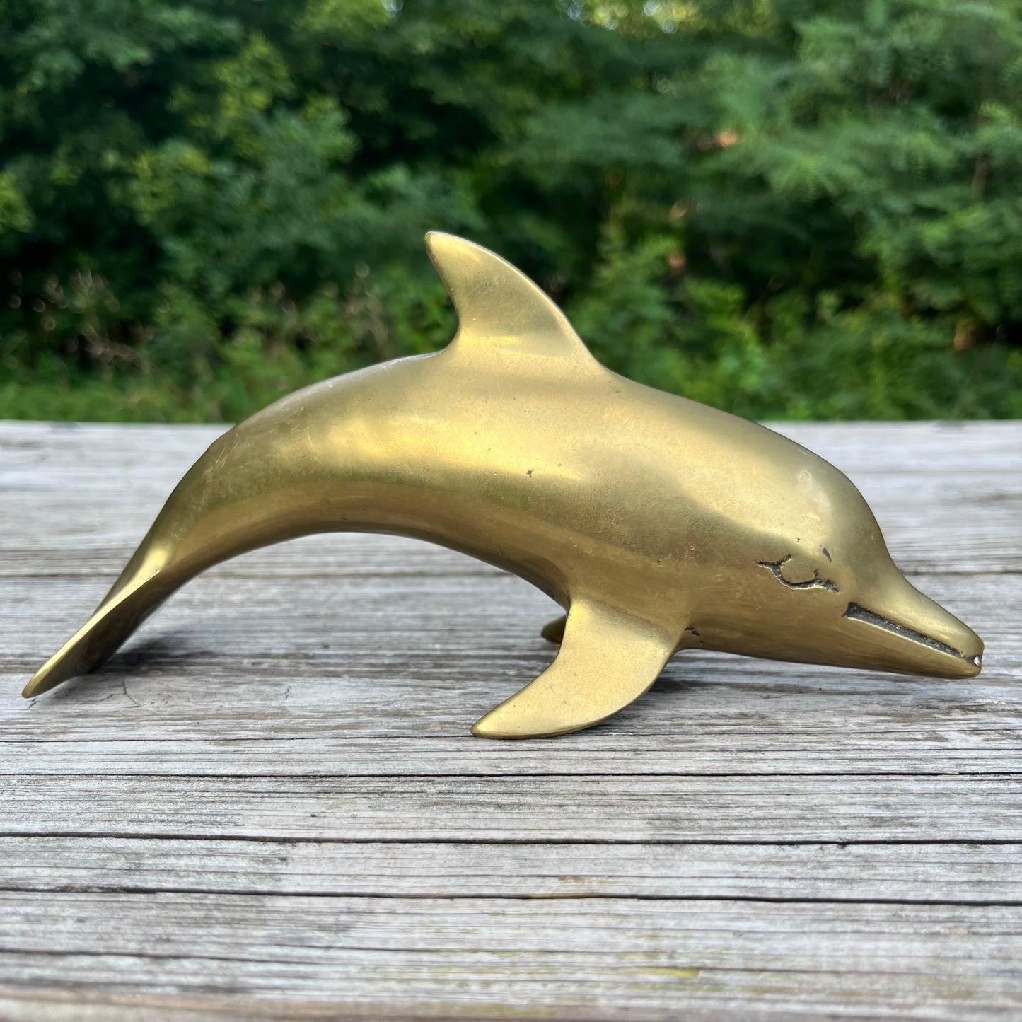 Vintage brass dolphin.