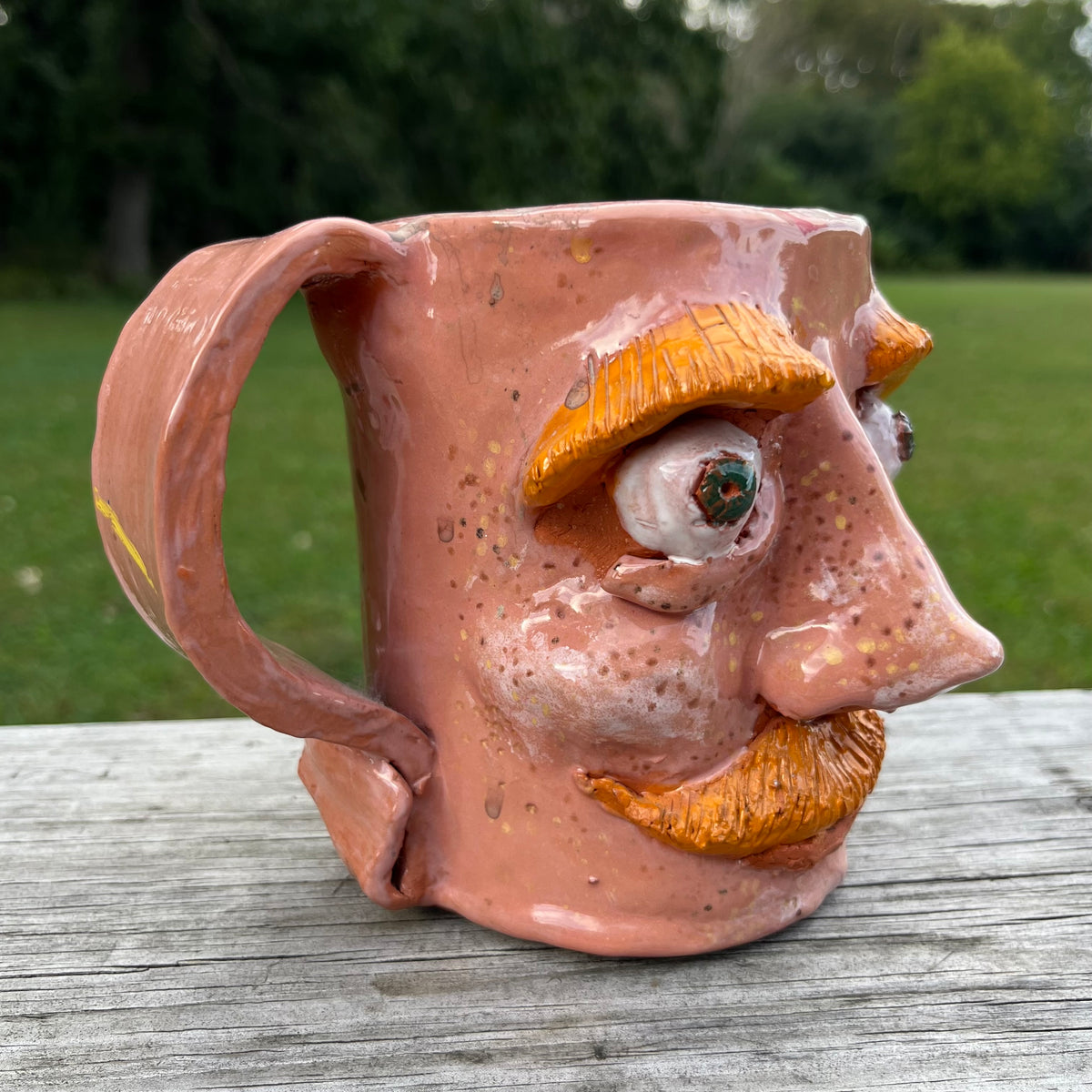 Vintage clay face mug.