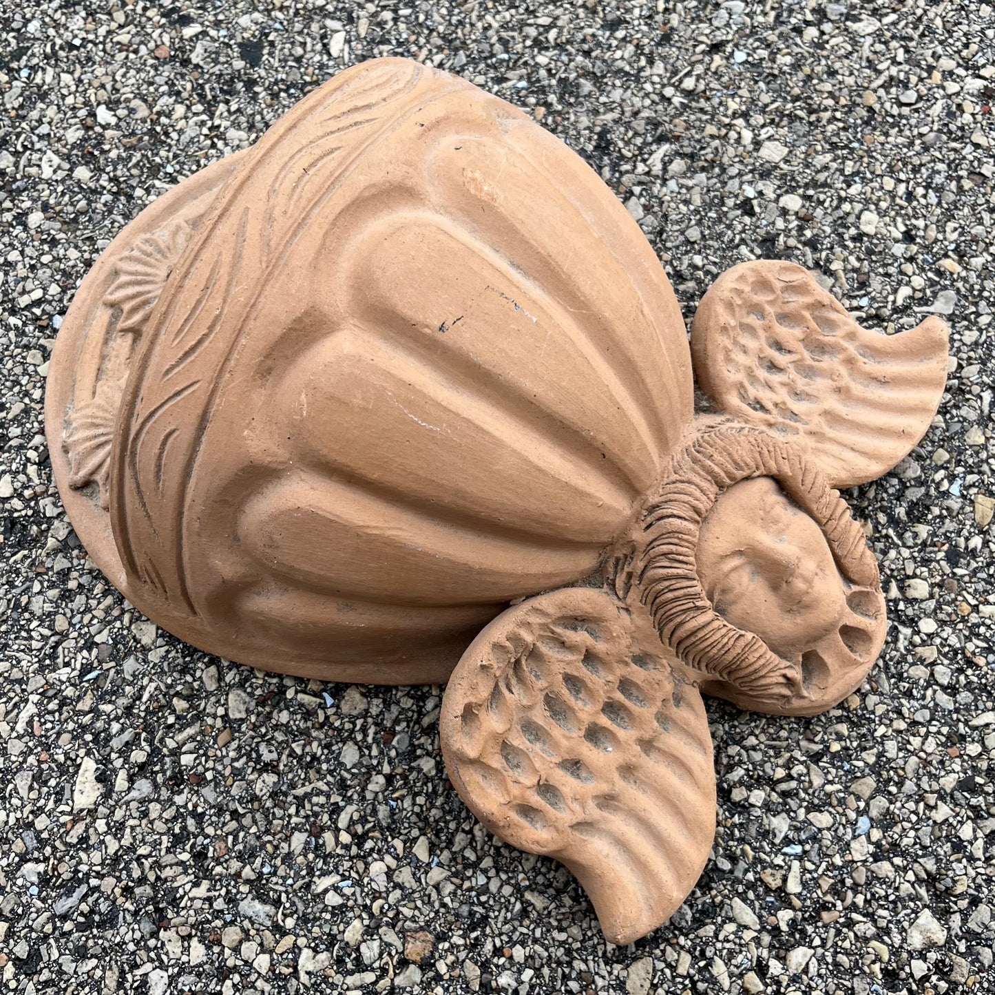 Vintage clay cherub wall planter.