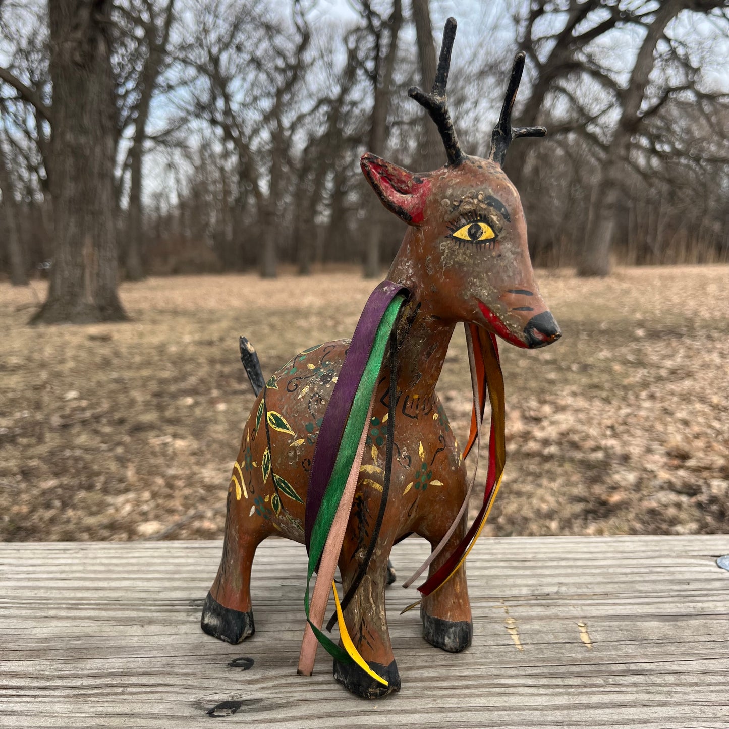 Hand crafted deer gourd maraca.