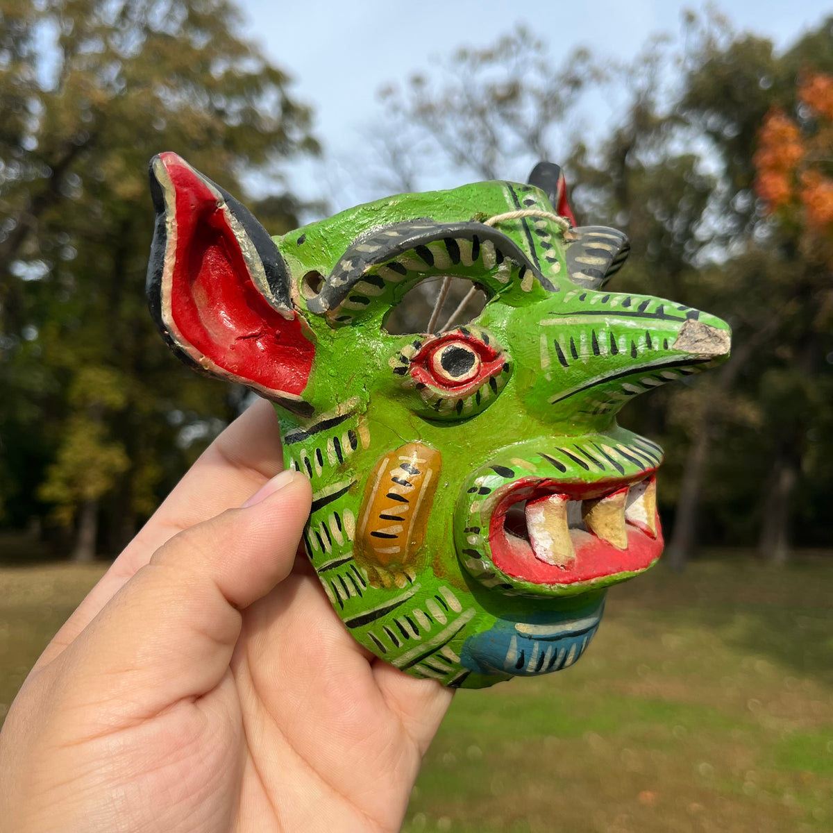 Vintage hand crafted green Diablo mask. (Chipped nose)