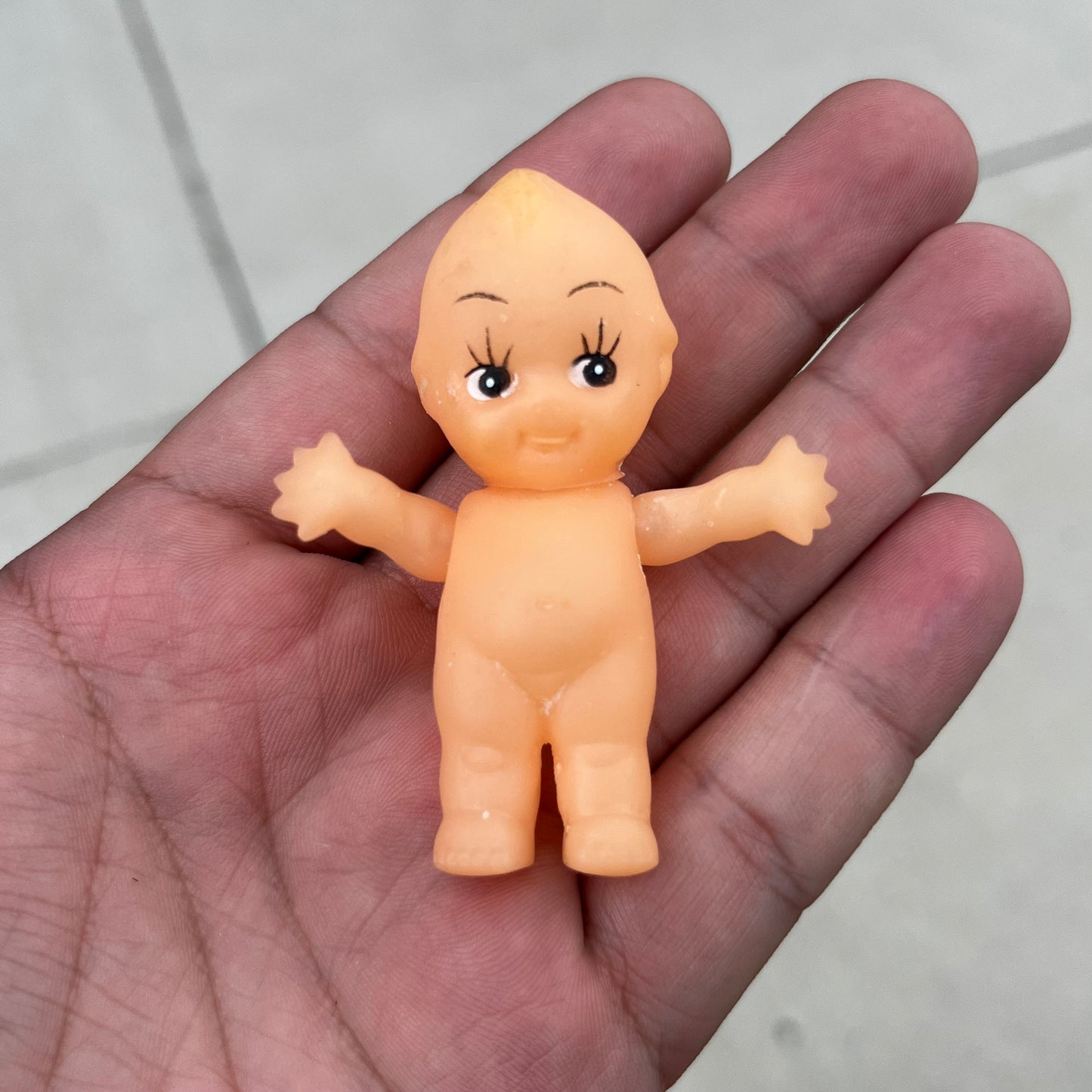 Vintage vinyl Kewpie doll.