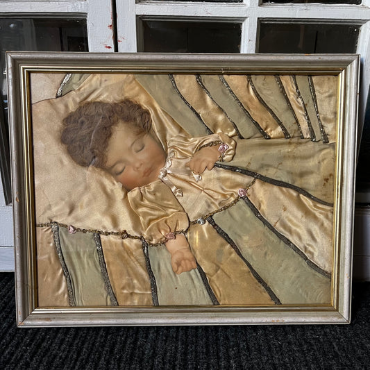 Early 1900s Sleeping baby portrait  made with real hair and silk.