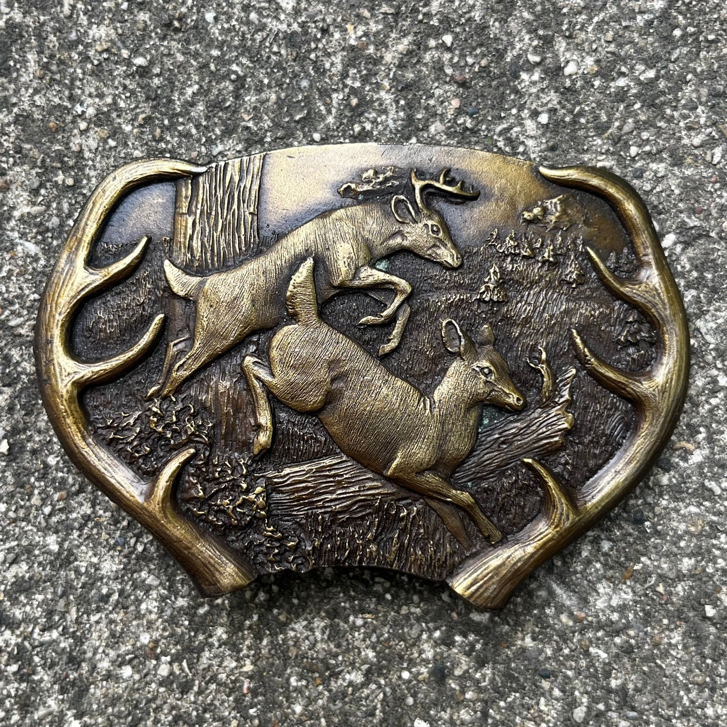1977 Brass deer belt buckle.