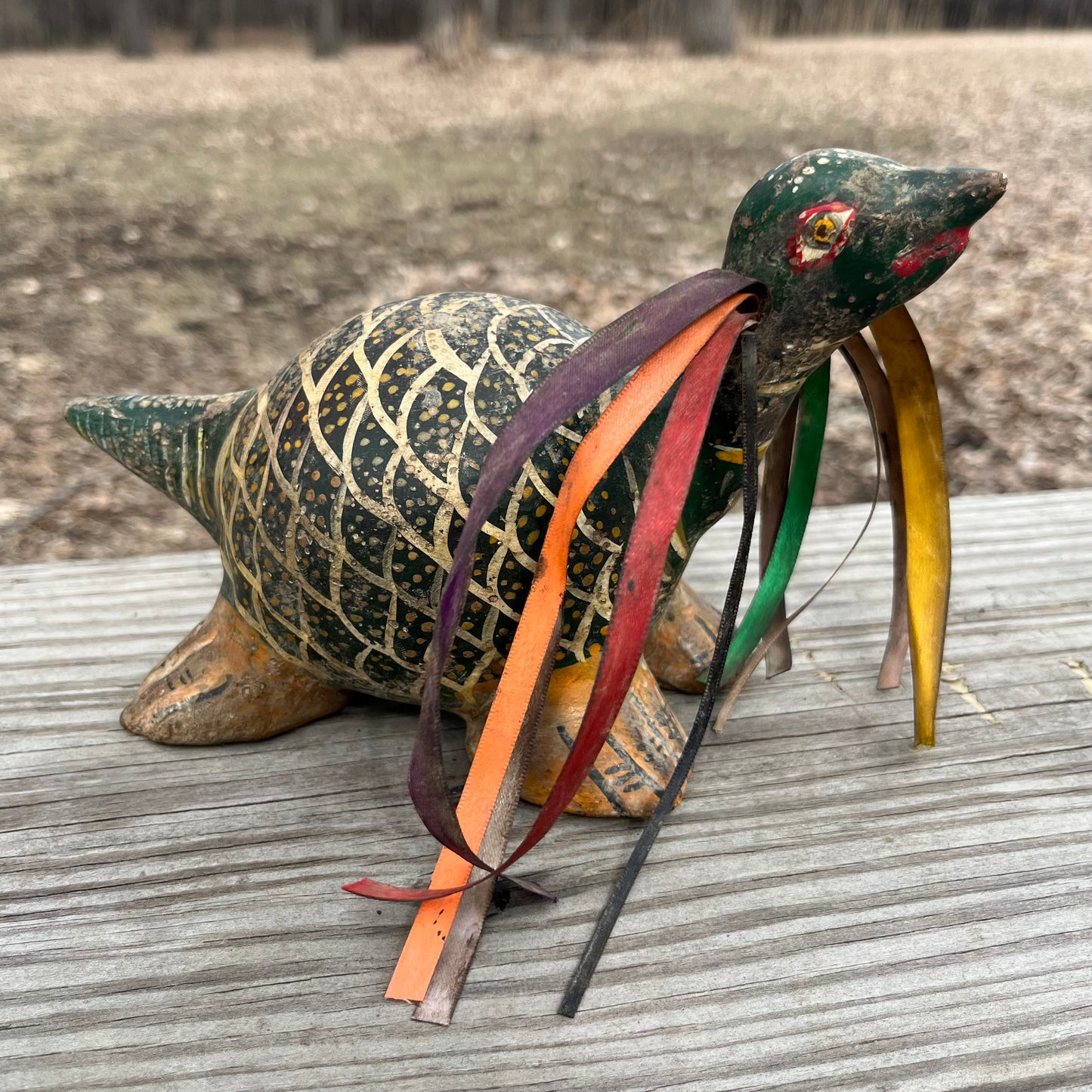 Hand crafted turtle gourd maraca.