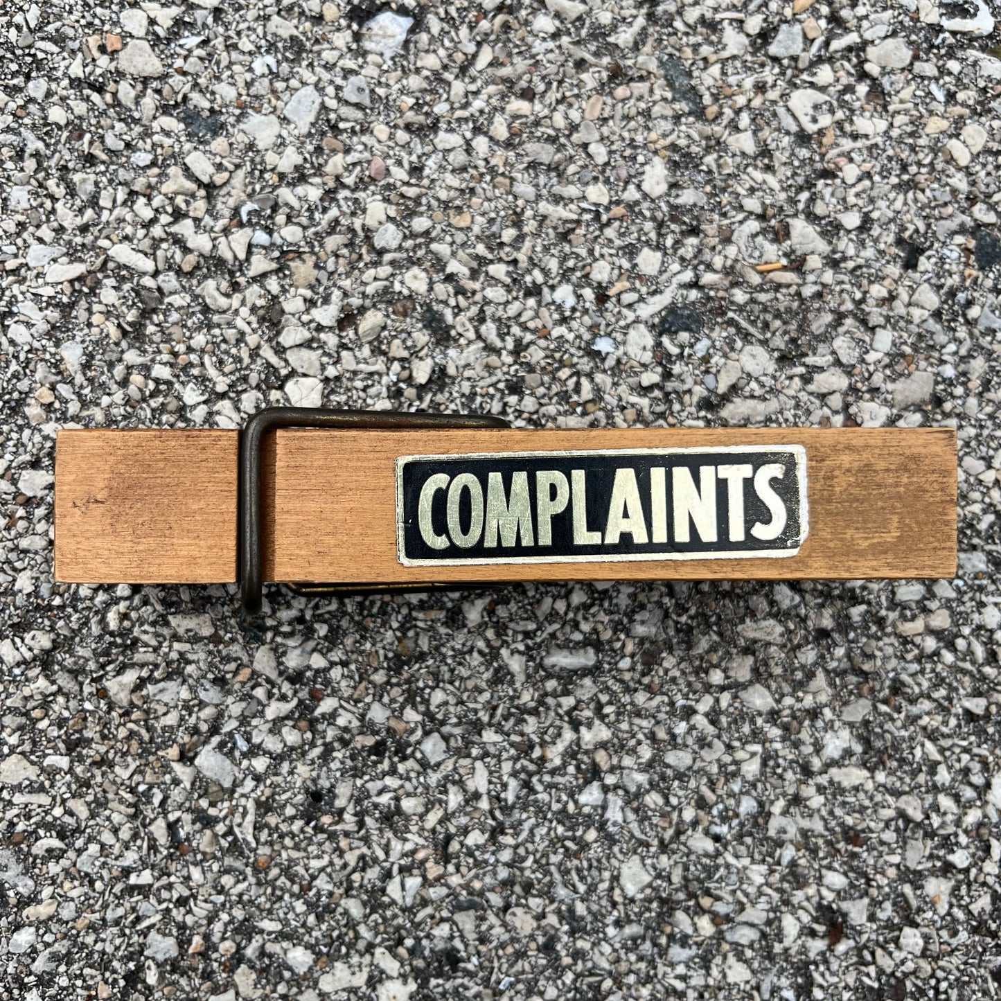 Vintage oversized “complaints” clothespin.