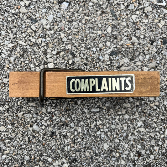 Vintage oversized “complaints” clothespin.