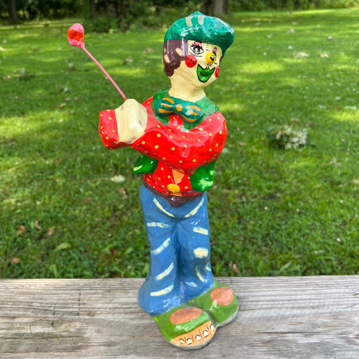 Vintage paper mache golfer clown.