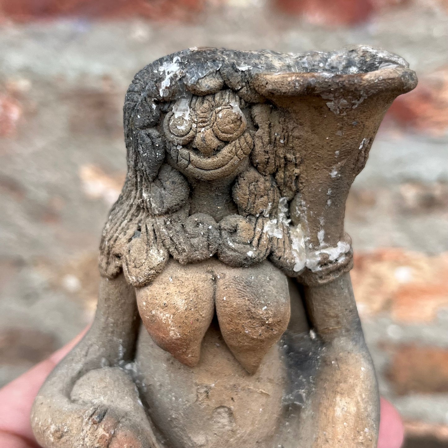Clay Balinese candle holder figurine.
