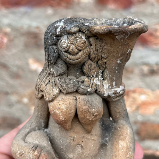 Clay Balinese candle holder figurine.