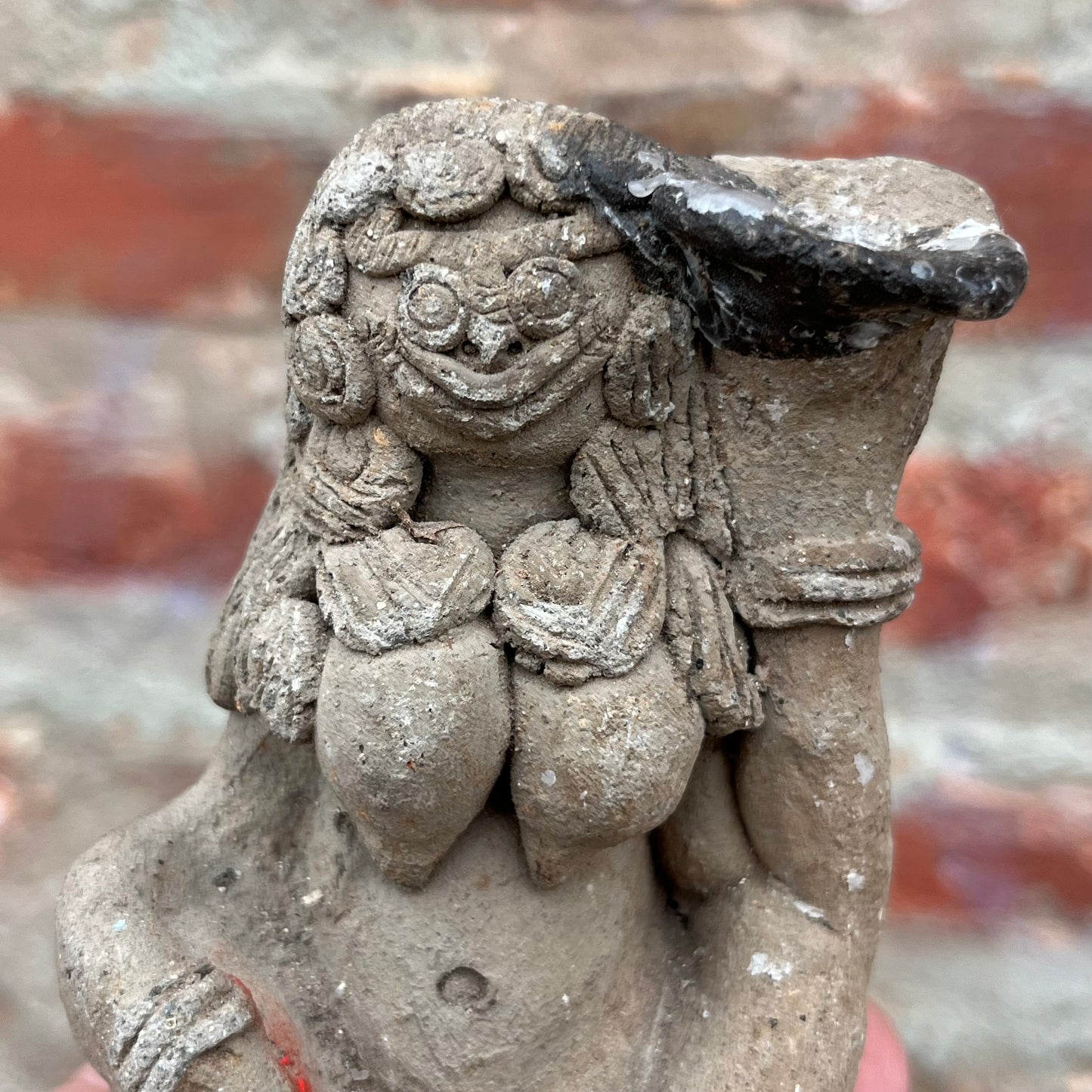 Clay Balinese candle holder figurine.