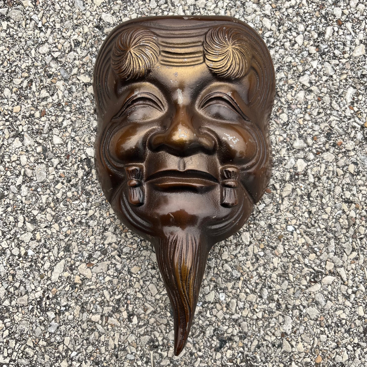 Vintage cast iron Okina mask.