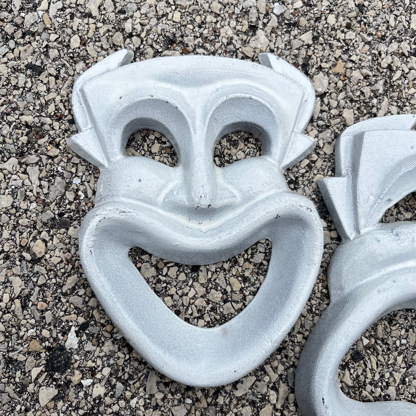 Vintage cast iron drama masks.