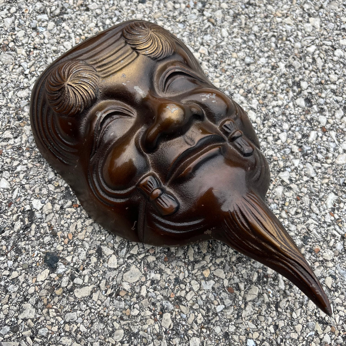 Vintage cast iron Okina mask.