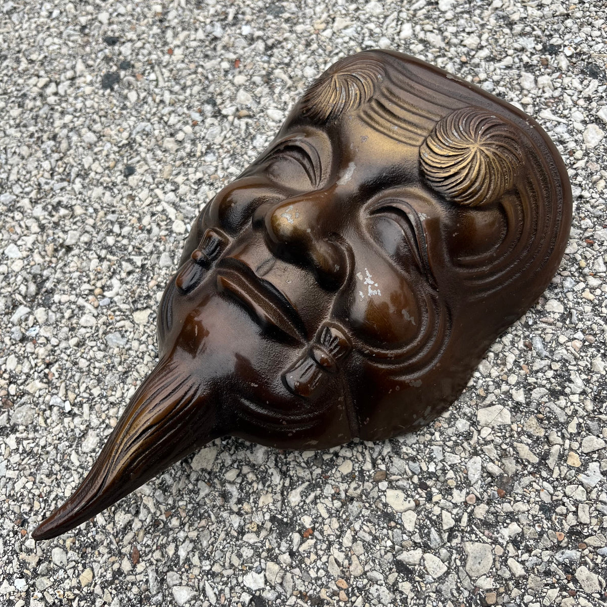 Vintage cast iron Okina mask.